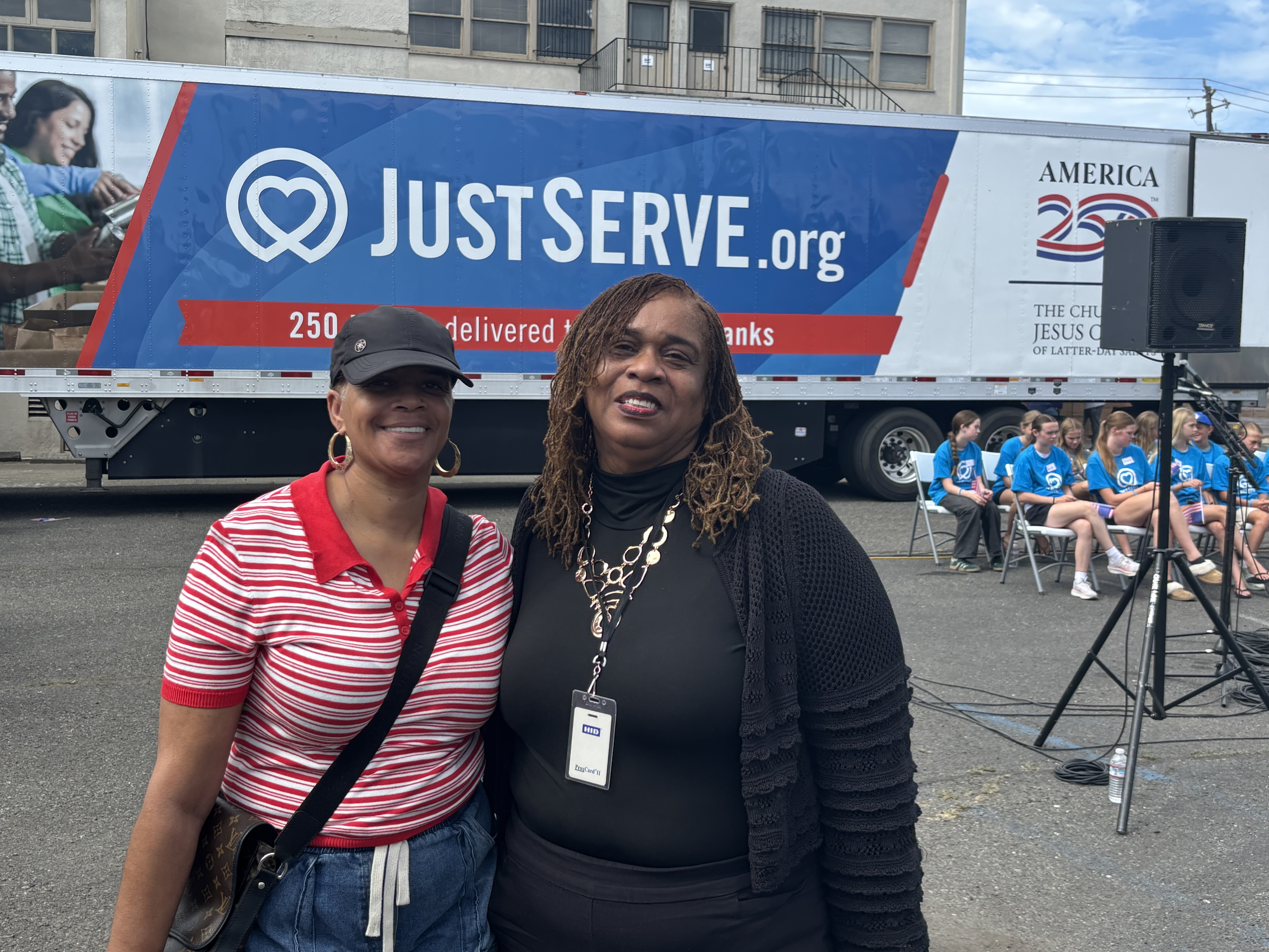 Word Assembly First Lady Denise Clark, left, joined Mt. Zion Missionary Baptist Church First Lady Velma Wallace at the food distribution site, where the first of the 250 truckloads of food LDS will provide to places across the country was distributed. Courtesy photo.