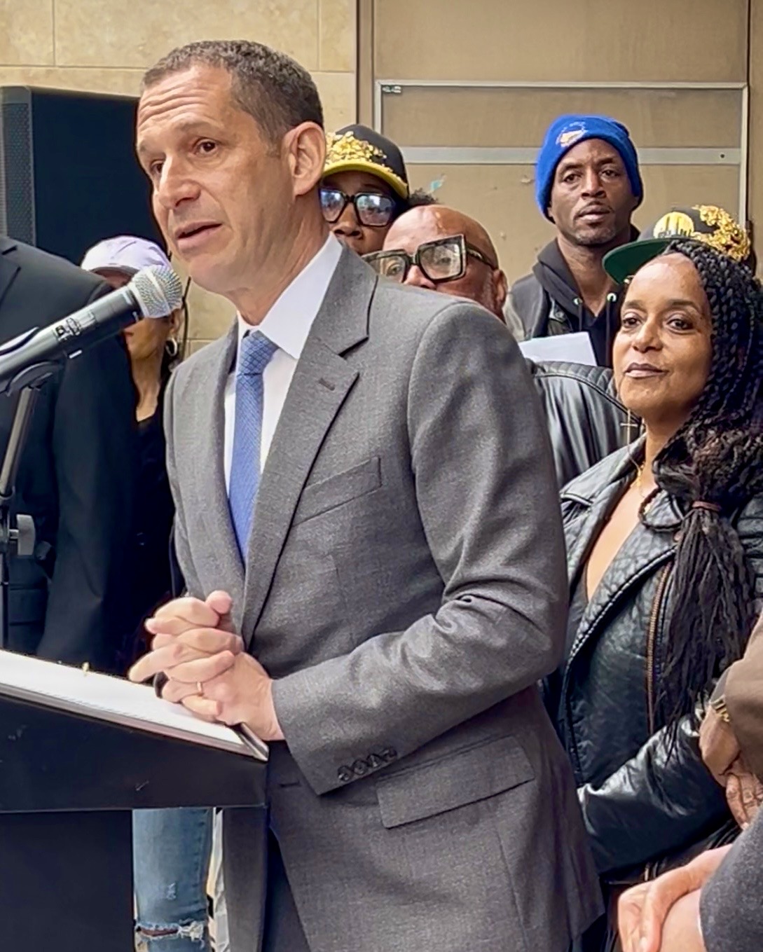 San Francisco Mayor Daniel Lurie announcing the reopening of the Fillmore Heritage Center. Erika Scott, owner of Honey Art Studio, looks on with pride.  Photo by Linda Parker Pennington.